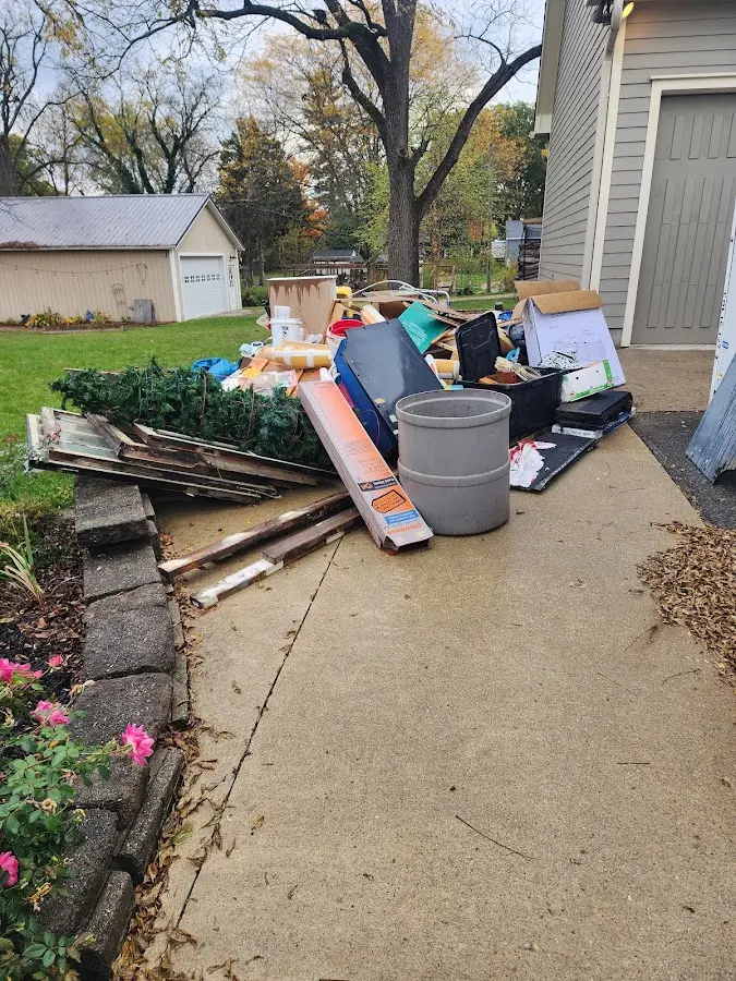 Dumpster being loaded with debris for 3 Yard Dumpster Rental in Wildwood